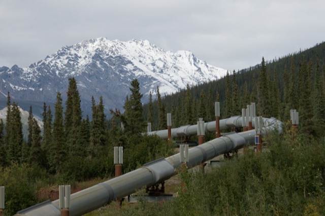 The Trans-Alaska Pipeline on elevated supports in front of the snow-capped Brooks Range